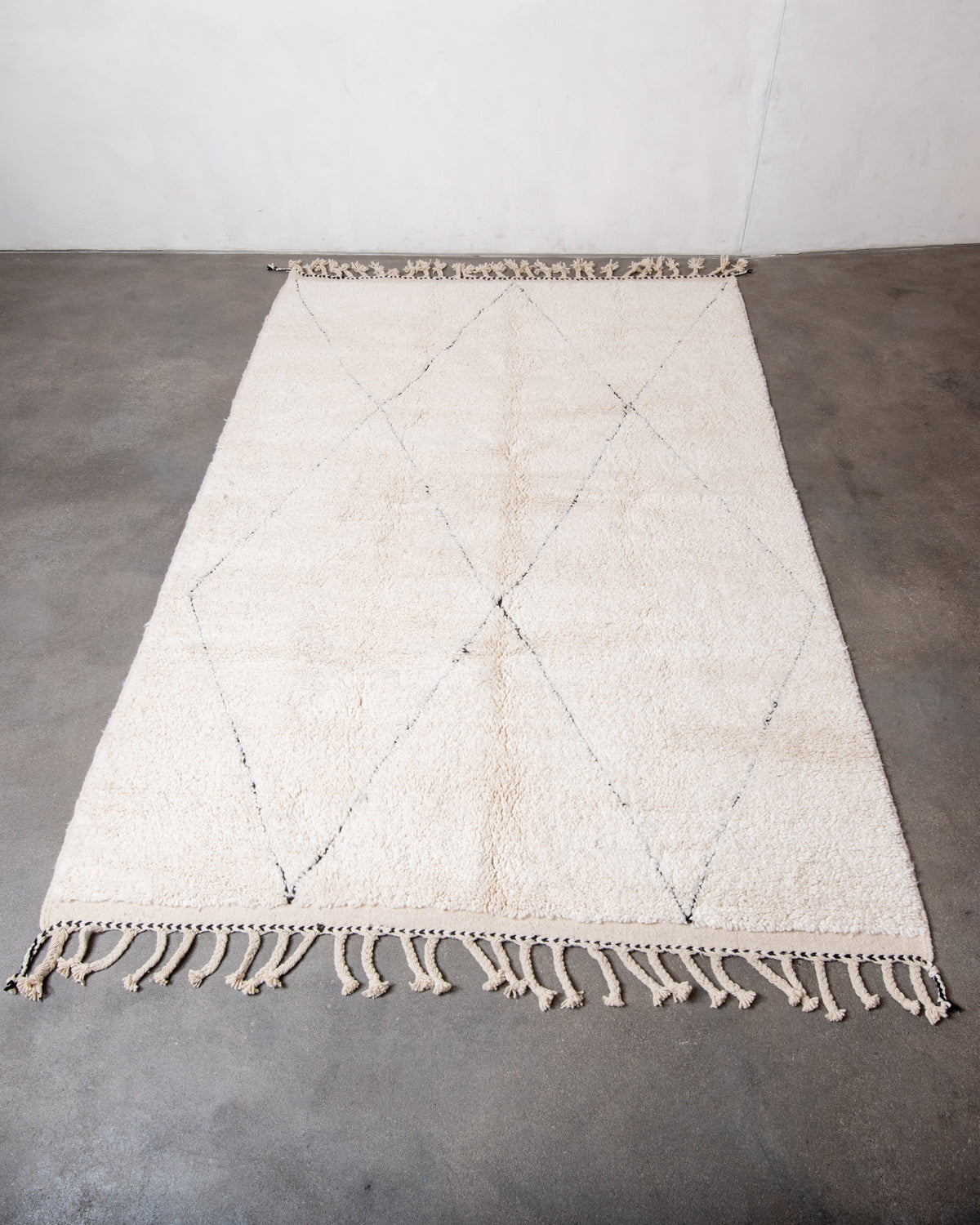 Modern, designer, handcrafted Berber rug from Morocco. Beniourain carpet with minimalist design, natural wool pile and a fluffy texture.